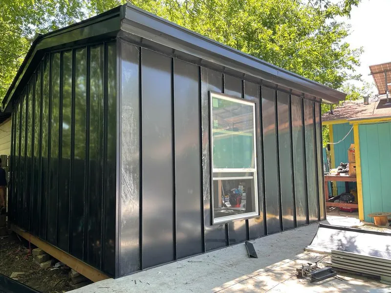 Black standing seam metal wall panels for Roof Inspection in Melvindale