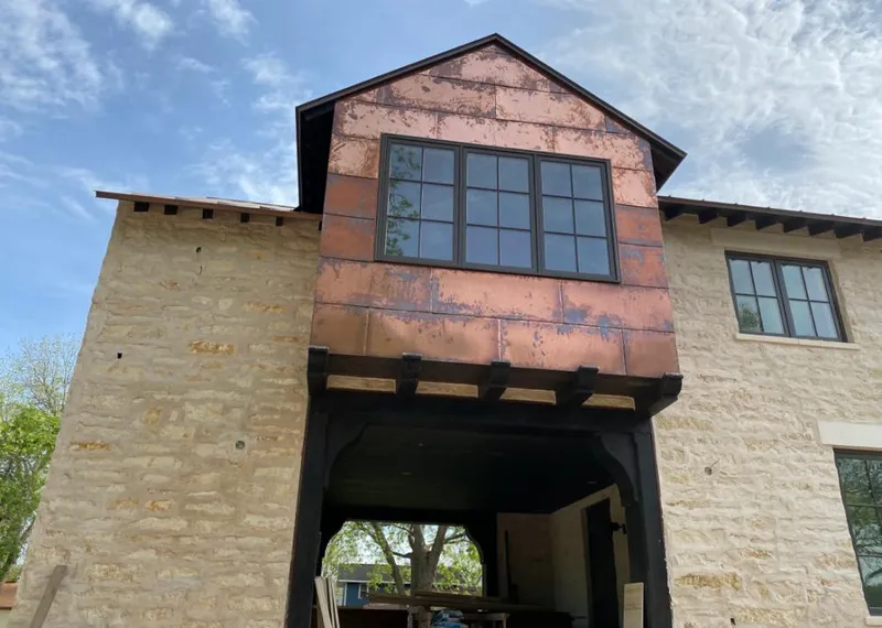 Copper metal panel facade on a stone building for Metal Roof Coating in Melvindale